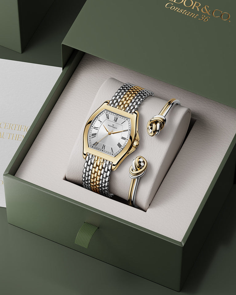 A square womens watch in 22k two-toned silver and gold plated 316L stainless steel from Waldor & Co. with domed mineral glass dial. Seiko movement. The model is Constant 36 Menaggio.