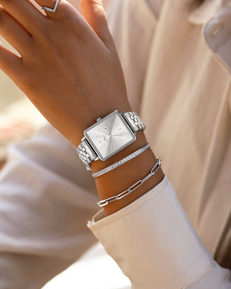 A polished stainless steel bangle in silver from Waldor & Co. One size. The model is Diamond Bangle Polished.