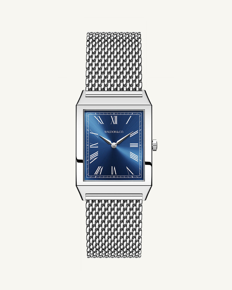A square mens watch in rhodium-plated silver from Waldor & Co. with blue sunray dial. Miyota movement. The model is Conceptual 37 Antibes.