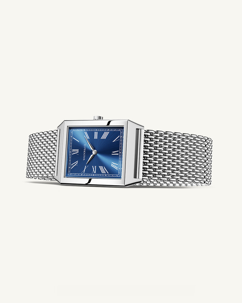 A square mens watch in rhodium-plated silver from Waldor & Co. with blue sunray dial. Miyota movement. The model is Conceptual 37 Antibes.