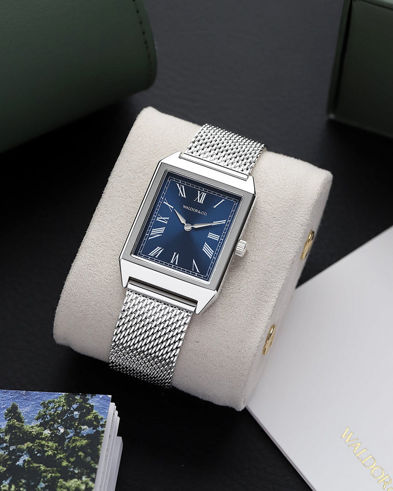 A square mens watch in rhodium-plated silver from Waldor & Co. with blue sunray dial. Miyota movement. The model is Conceptual 37 Antibes.