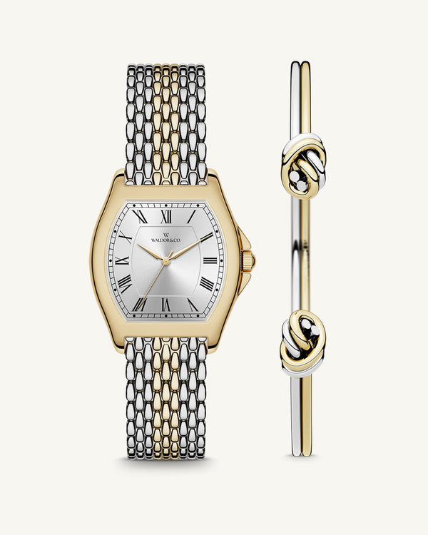 A square womens watch in 22k two-toned silver and gold plated 316L stainless steel from Waldor & Co. with domed mineral glass dial. Seiko movement. The model is Constant 36 Menaggio.