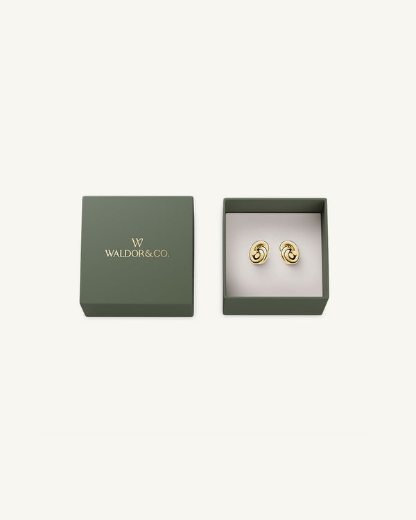 Earrings in gold plated-316L stainless steel from Waldor & Co. The model is Dual Knot Earring Polished.