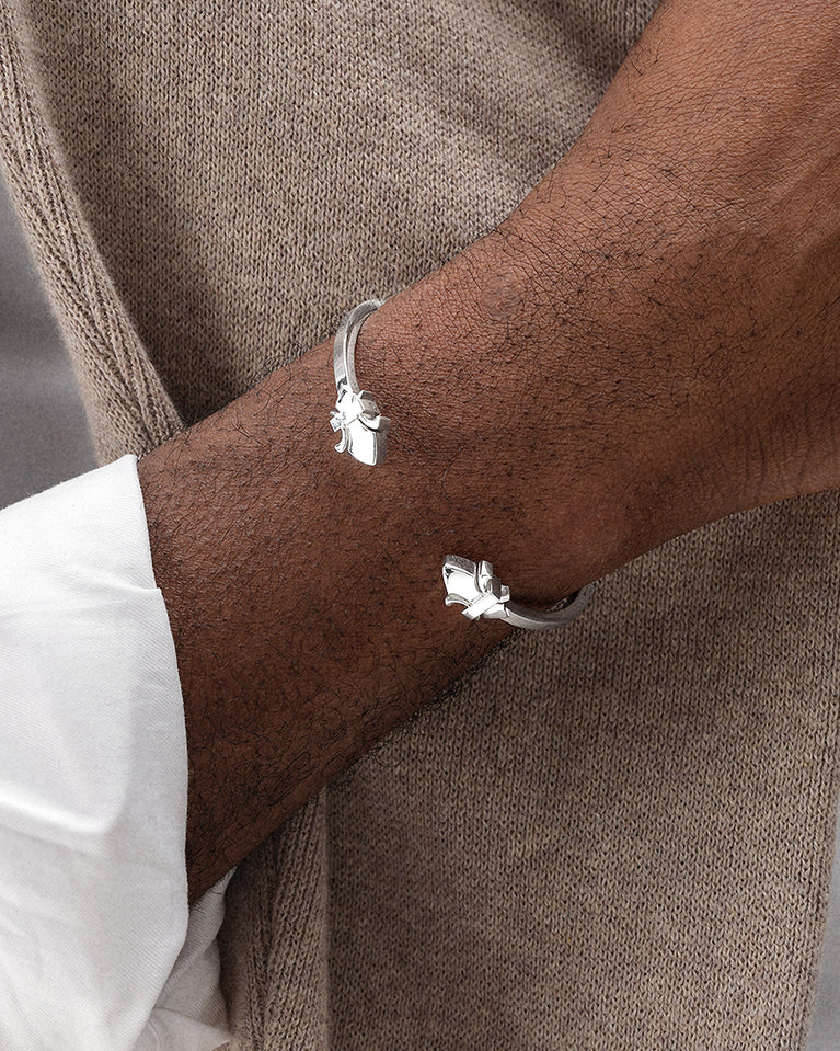 A polished stainless steel bangle in silver from Waldor & Co. One size. The model is Icon Bangle Polished.