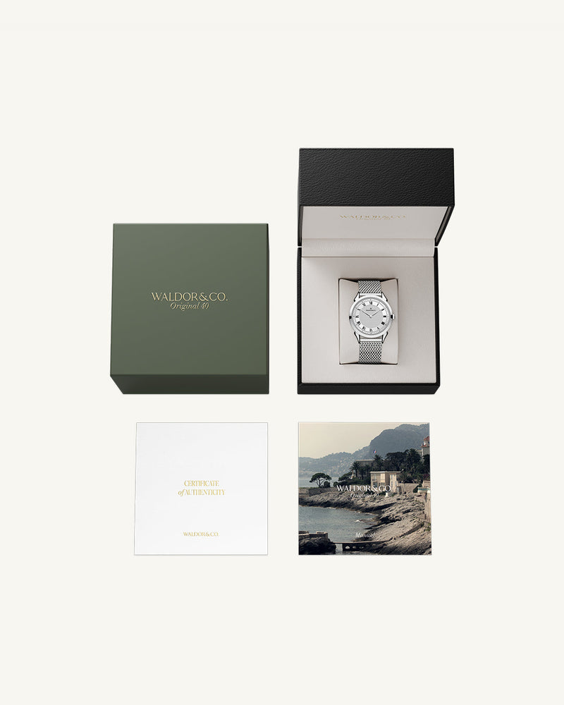 A round watch in silver from Waldor & Co. with white sunray patterned dial. Ronda movement. The model is Original 40 Côte d'Azur 40mm.