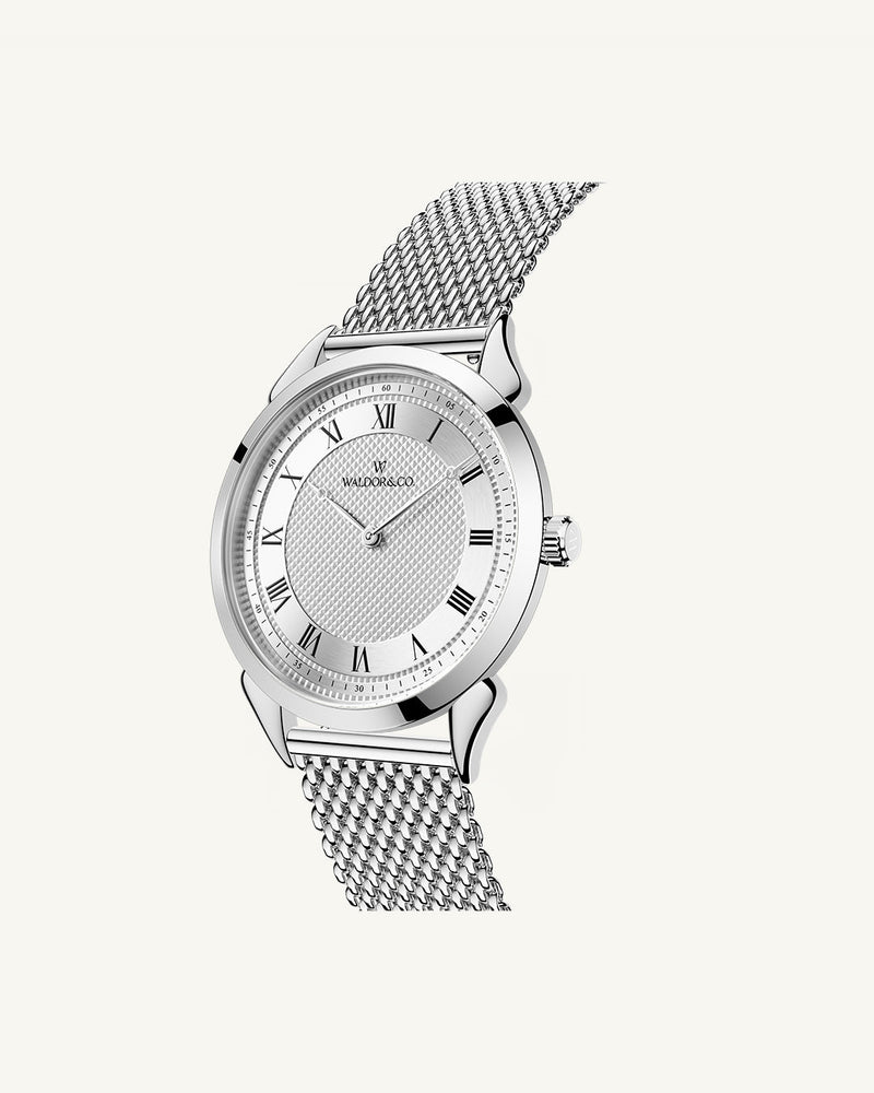 A round watch in silver from Waldor & Co. with white sunray patterned dial. Ronda movement. The model is Original 40 Côte d'Azur 40mm.
