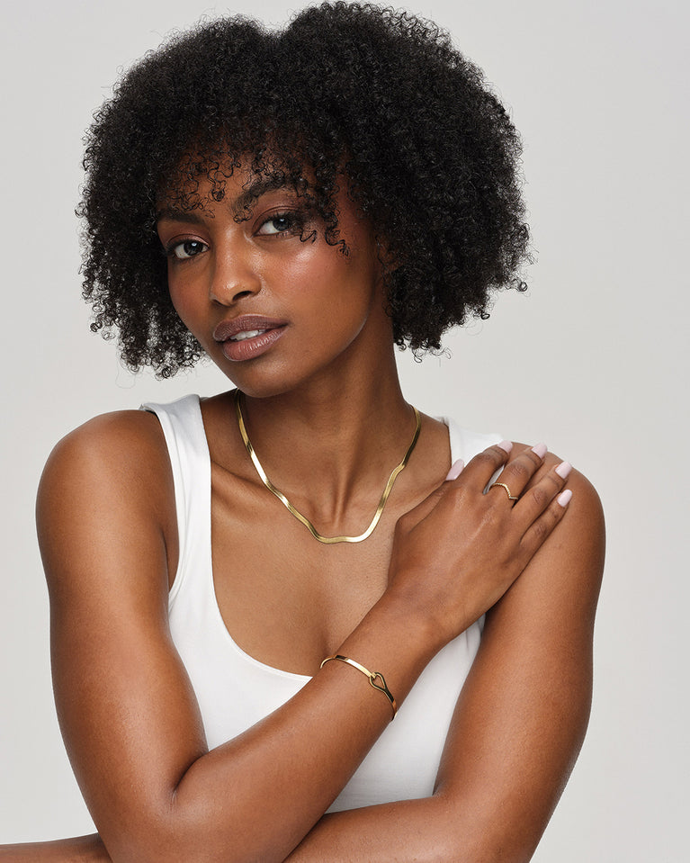 A Ring in polished 14k gold plated 316L stainless steel from Waldor & Co. The model is Chloé Ring Polished.