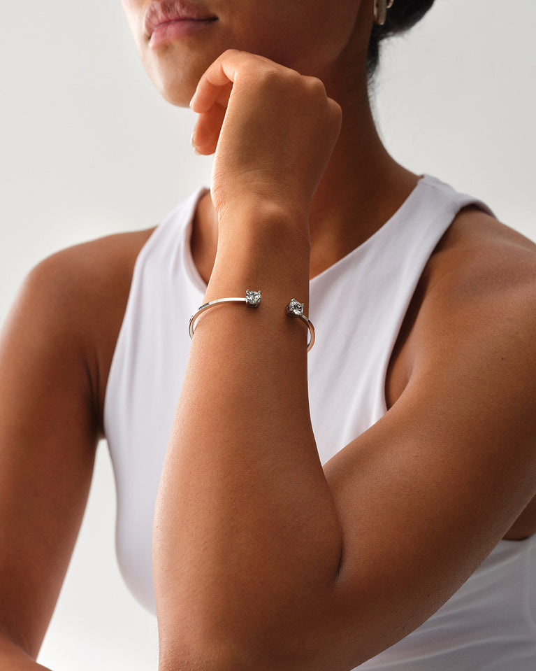 A Bangle in polished silver 316L stainless steel from Waldor & Co. One size. The model is Zircon Bangle Polished.