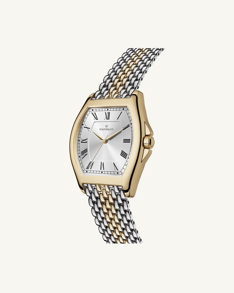 A square womens watch in 22k two-toned silver and gold plated 316L stainless steel from Waldor & Co. with domed mineral glass dial. Seiko movement. The model is Constant 36 Menaggio.