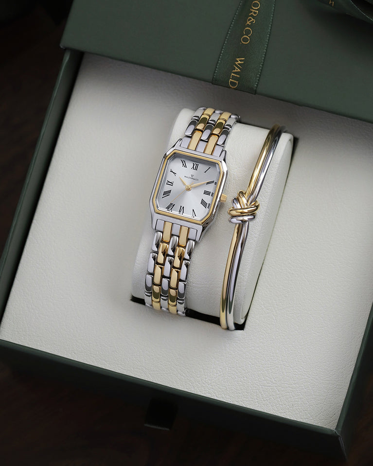 A square womens watch in 22k gold plated 316L stainless steel from Waldor & Co. with white Diamond Cut Sapphire Crystal glass dial. Seiko movement. The model is Eternal 22 Bellagio