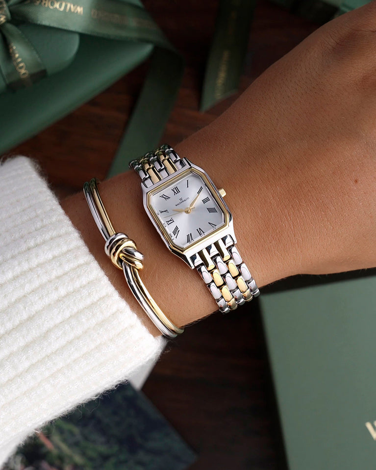 A square womens watch in 22k gold plated 316L stainless steel from Waldor & Co. with white Diamond Cut Sapphire Crystal glass dial. Seiko movement. The model is Eternal 22 Bellagio