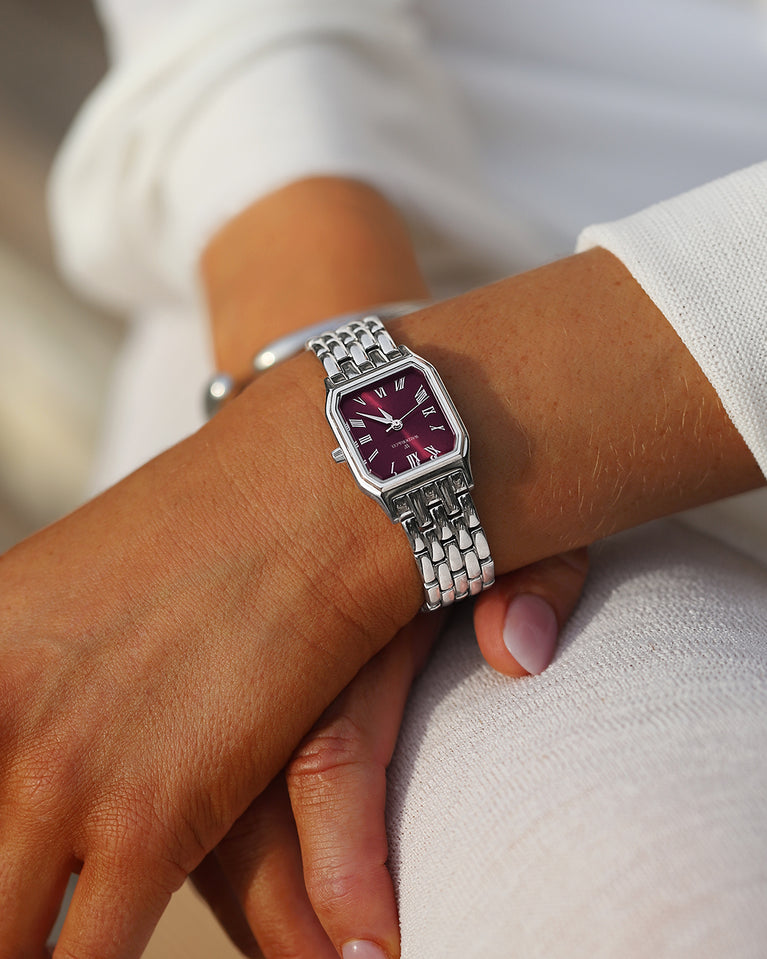 A square womens watch in Rhodium-plated 316L stainless steel from Waldor & Co. with burgundy Diamond Cut Sapphire Crystal glass dial. Seiko movement. The model is Eternal 22 Bellagio.