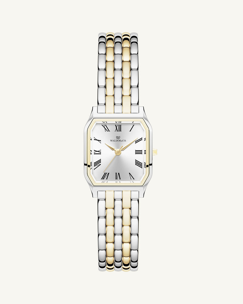 A square women’s watch and double knot bracelet in gold and silver from Waldor & co. The model is Eternal 22 Bellagio & Dual Knot Bangle.'