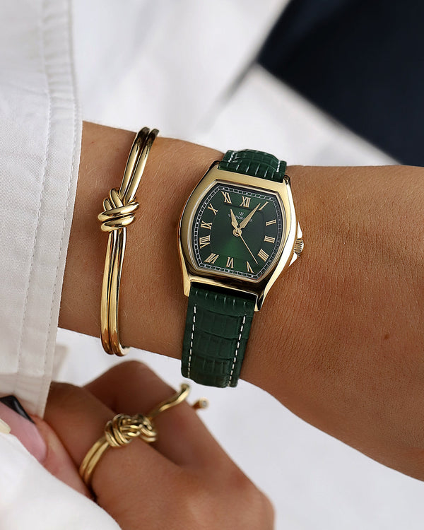  A square womens watch in 22k gold plated 316L stainless steel from Waldor & Co. with domed mineral glass dial. Seiko movement. The model is Constant 36 Laglio.